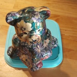 Shelf sitter cloth enclosed in glass bear